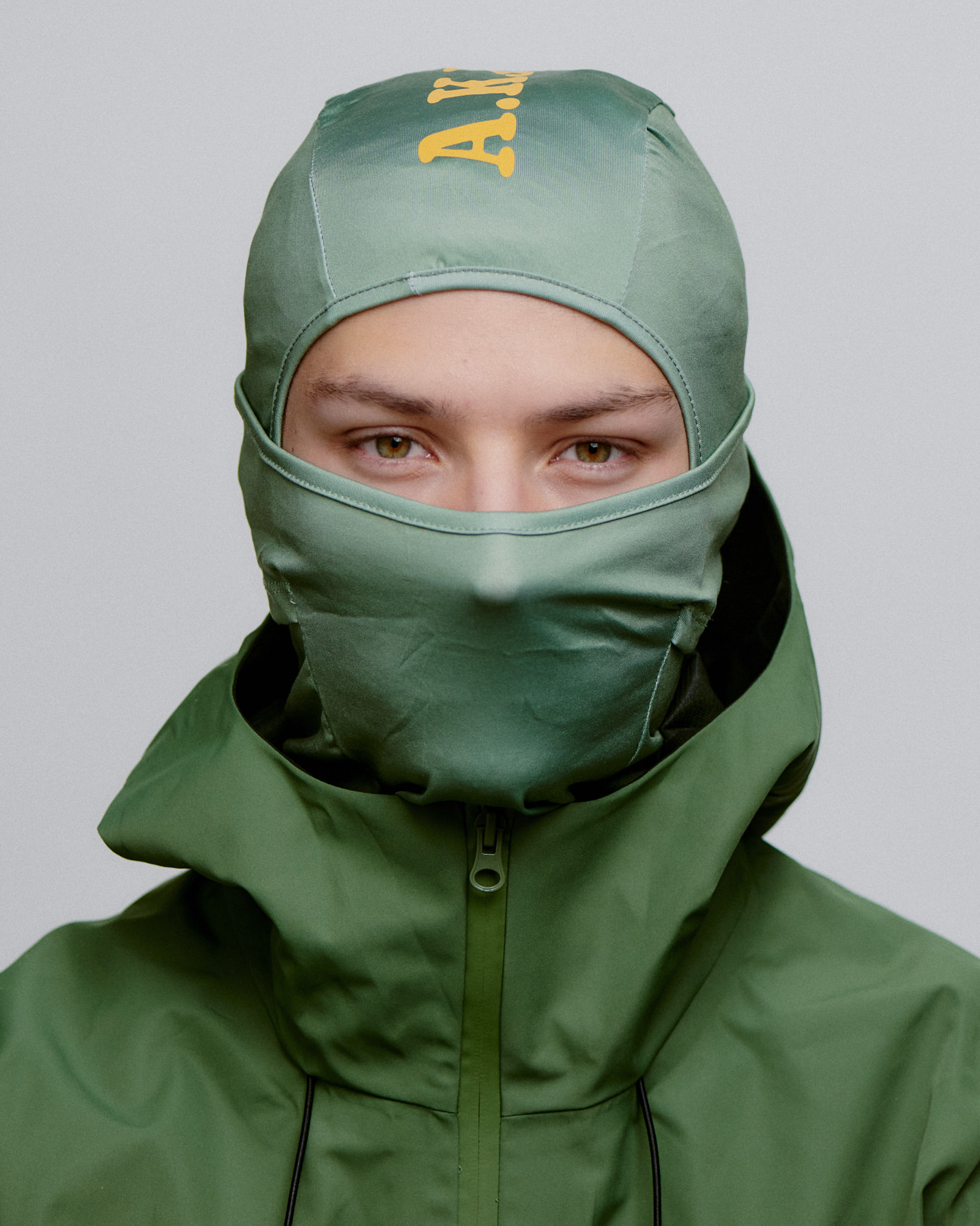 Grøn A.Kjærbede balaclava til ski, orange logo