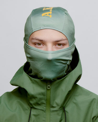 Grøn A.Kjærbede balaclava til ski, orange logo