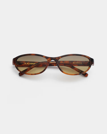 Smalle cat-eye plettede brune A.Kjærbede solbriller med gul glas - liggende